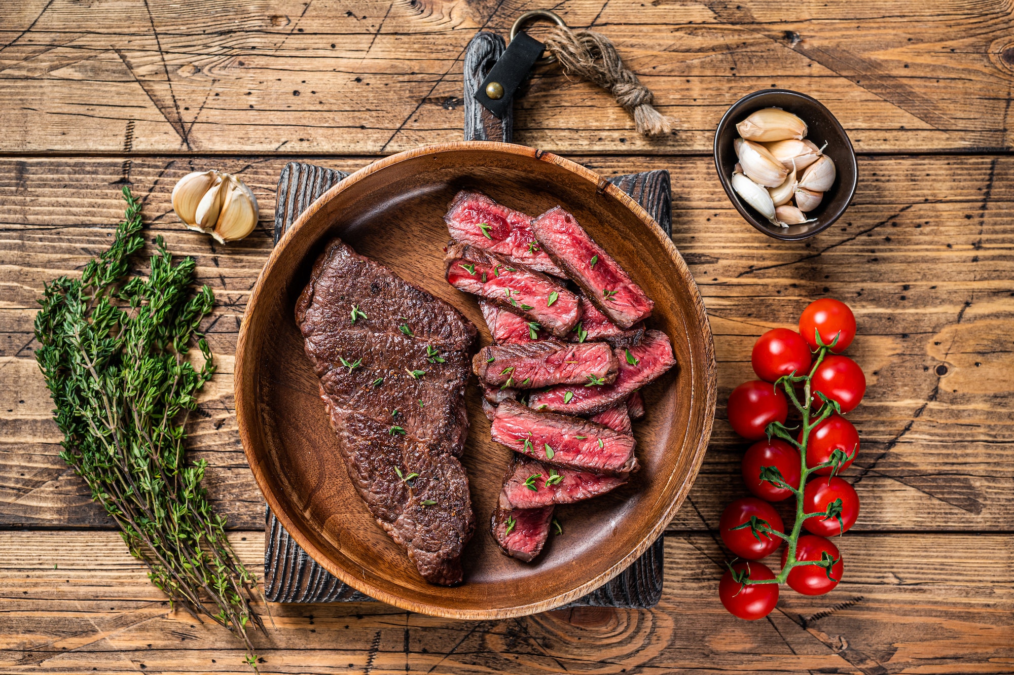grilled-sliced-top-blade-or-denver-beef-meat-steak-in-a-wooden-plate-with-herbs-.jpg grilled-sliced-top-blade-or-denver-beef-meat-steak-in-a-wooden-plate-with-herbs-.jpg