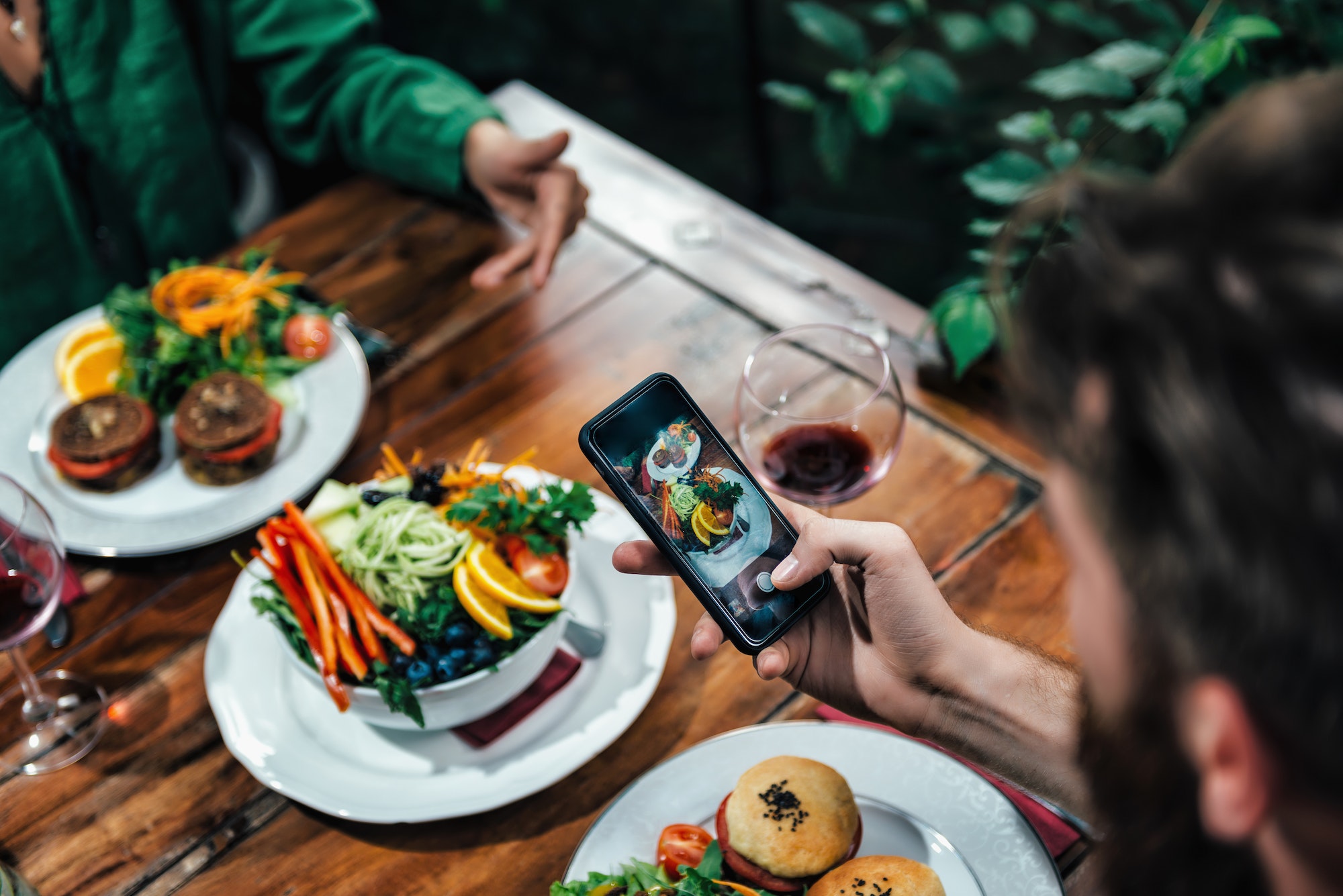 man-photographing-food-in-a-restaurant.jpg